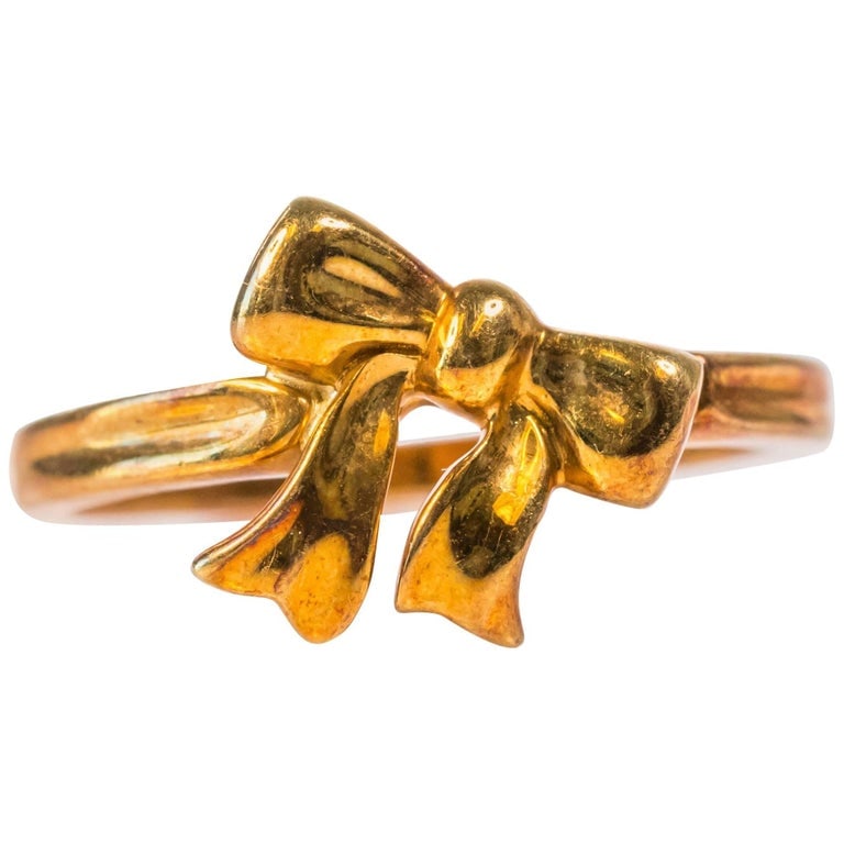 Tiffany & Co. 18K Gold Ribbon Bow Ring: Circa: 1980s, Brand: Tiffany & Co., Metal type: 18k yellow gold, Design: Ribbon bow ring, Size: 7.75, Weight: 5.2 grams