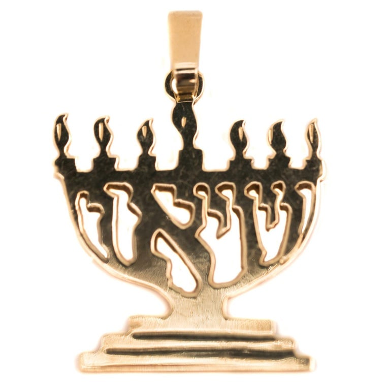 1970s Menorah Pendant in 14K Yellow Gold: Circa: 1970s, Metal type: 14k yellow gold, Design: Menorah pendant, Measurement: 2.2 cm L x 3.2 cm H including bail, Weight: 3.6 grams