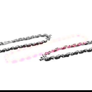 14 Karat White Gold Vintage Ruby and Diamond Tennis Bracelet: Metal type: 14k white gold, Gemstones: Vivid red ruby that are calibrated oval (Rubies have a pigeon blood red color) and diamond accent, Design: Tennis bracelet, Measurement: 7.5" Length, Weight: 6.9
