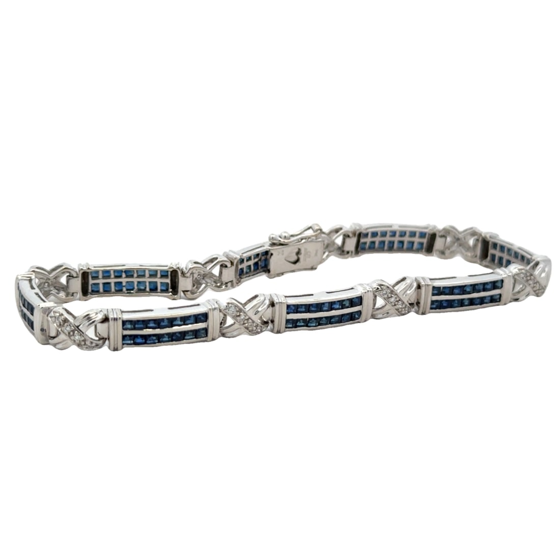 3.82CTW Sapphire and Diamond Bracelet, 14K White Gold: 14K white gold bracelet with 112 princess cut sapphires at 3.82ctw and 32 round diamonds at 0.32CTW, 7.25"L, 13.45g