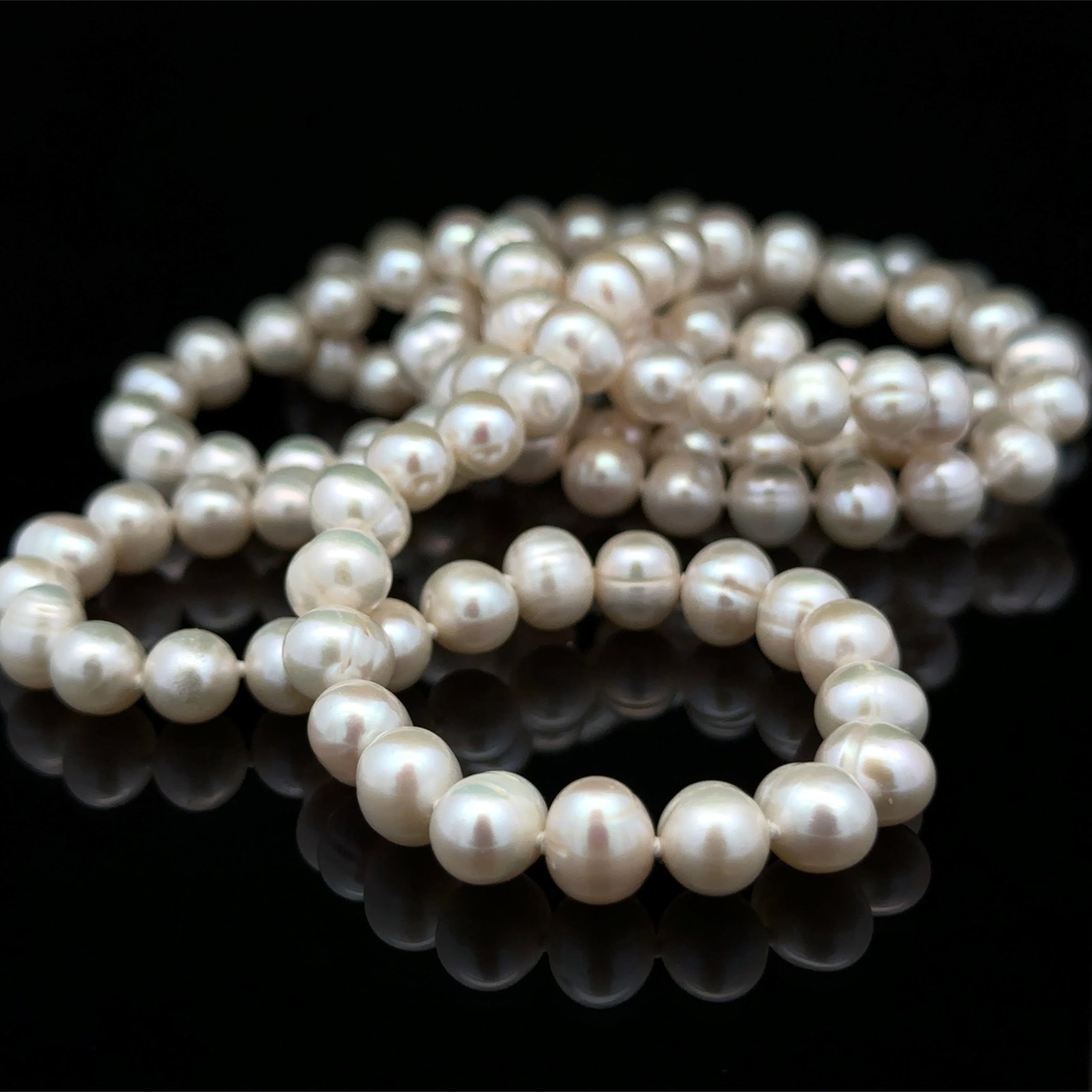 White Fresh Water Pearl Necklace in Sterling Silver: Metal type: Sterling Silver, Gemstones: White fresh water pearl - 8.9 mm diameter, Measurement: 42" Length, Weight: 163.1 grams