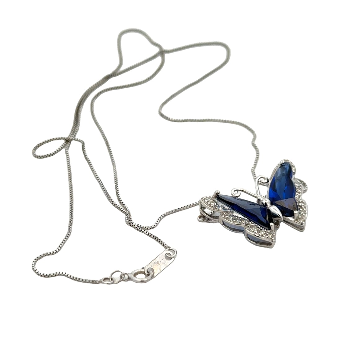 Synthetic Sapphire and Diamond Butterfly Pendant Necklace in 10K White Gold: Metal type: 10k white gold, Gemstones: Synthetic sapphire and .09ctw diamond, Design: Butterfly pendant and necklace, Pendant measurement: 2.3 cm L x 1.7 cm H, Necklace measurement: 18" Length, Weight
