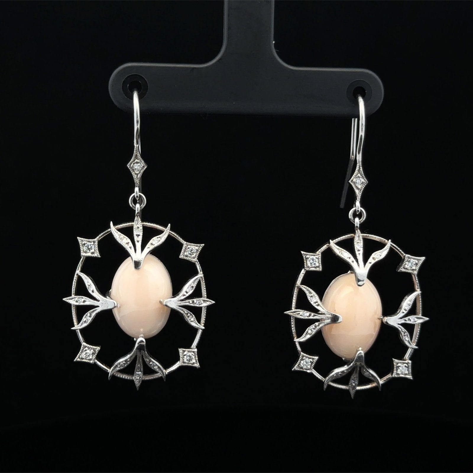 Angel Skin Coral and Diamond Earrings in Platinum: Metal type: Platinum, Gemstones: Angel skin coral and .40ct VS/SIdiamond, Measurement: Approximately 2" Length, Weight: 13.5 grams