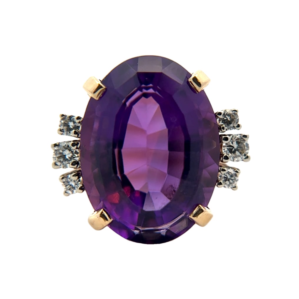 11.93ct Amethyst and Diamond Ring, 14K Gold: 14 karat yellow gold ring with 11.93ct oval amethyst and accent diamonds at 0.14ctw, size US 5, 5.97g