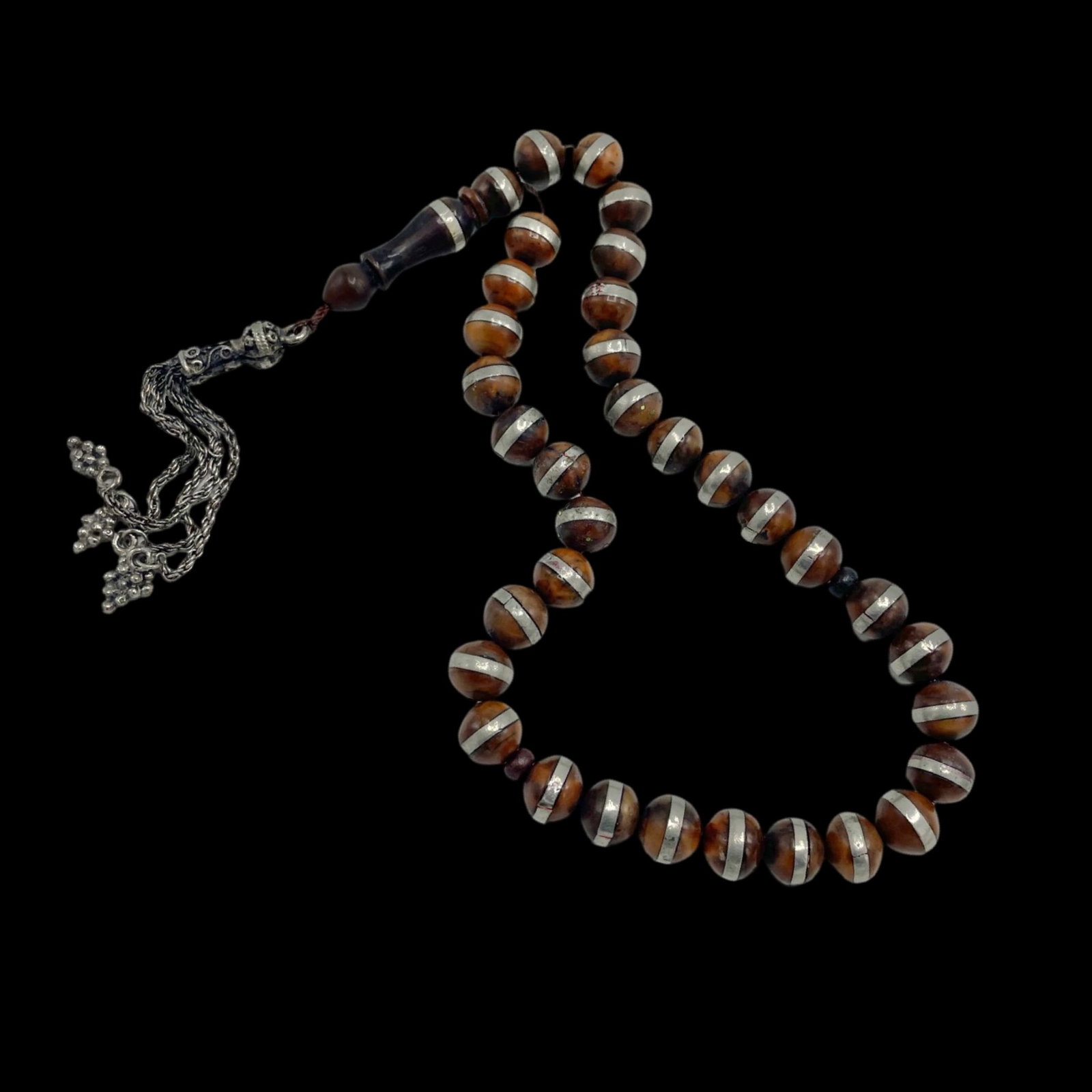 Early 20th Century Turkish Islamic Coquilla Prayer Beads Rosary: Early 20th century Turkish Islamic Coquilla prayer beads misbaha rosary. Beads are 1 cm in diameter, and are decorated with silver bands. Combined shipping is available for this item.