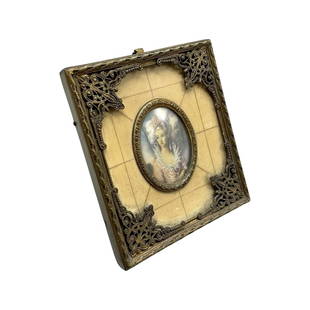 19th Century French Handpainted Miniature Portrait with Ivory and Guilt Bronze Frame: 19th century French handpainted and artist-signed miniature portrait with ivory and gilt bronze frame, with its original curved protective glass cover, 8 x 9 cm. Combined shipping is available for thi