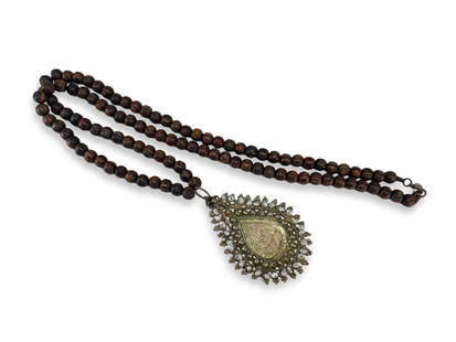 Ottoman Turkish Islamic Tombak (Gilt) Copper "Armudiye" Necklace: Description: Ottoman Turkish Islamic tombak (gilt) copper "Armudiye" amulet necklace with rosewood beads. The frame of the "armudiye" pendant is decorated with micro pearls. Condition: in very