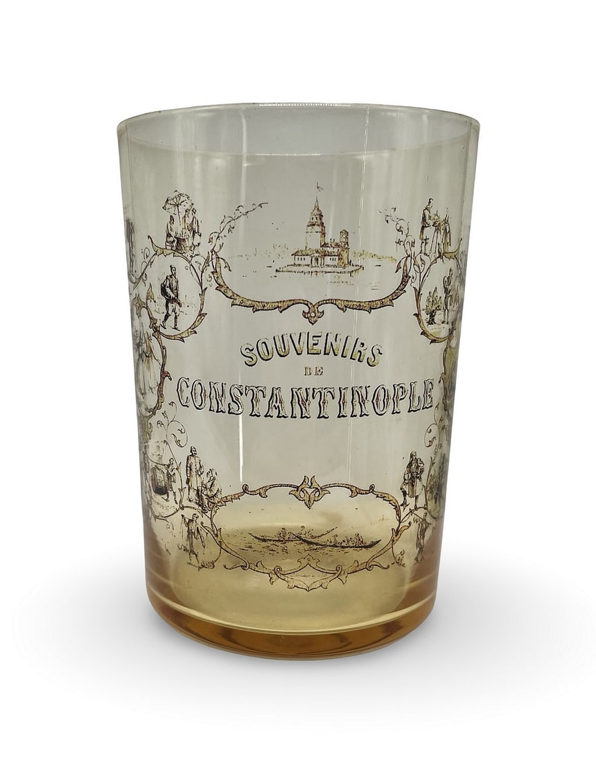 1900s Souvenir de Constantinople Water Glass: Description: 1900s Souvenir de Constantinople water glass, 9 cm high. It shows sights and scenes of Istanbul, including Kizkulesi, Ottoman ladies, Sultan's rowing boats, different types of street murc