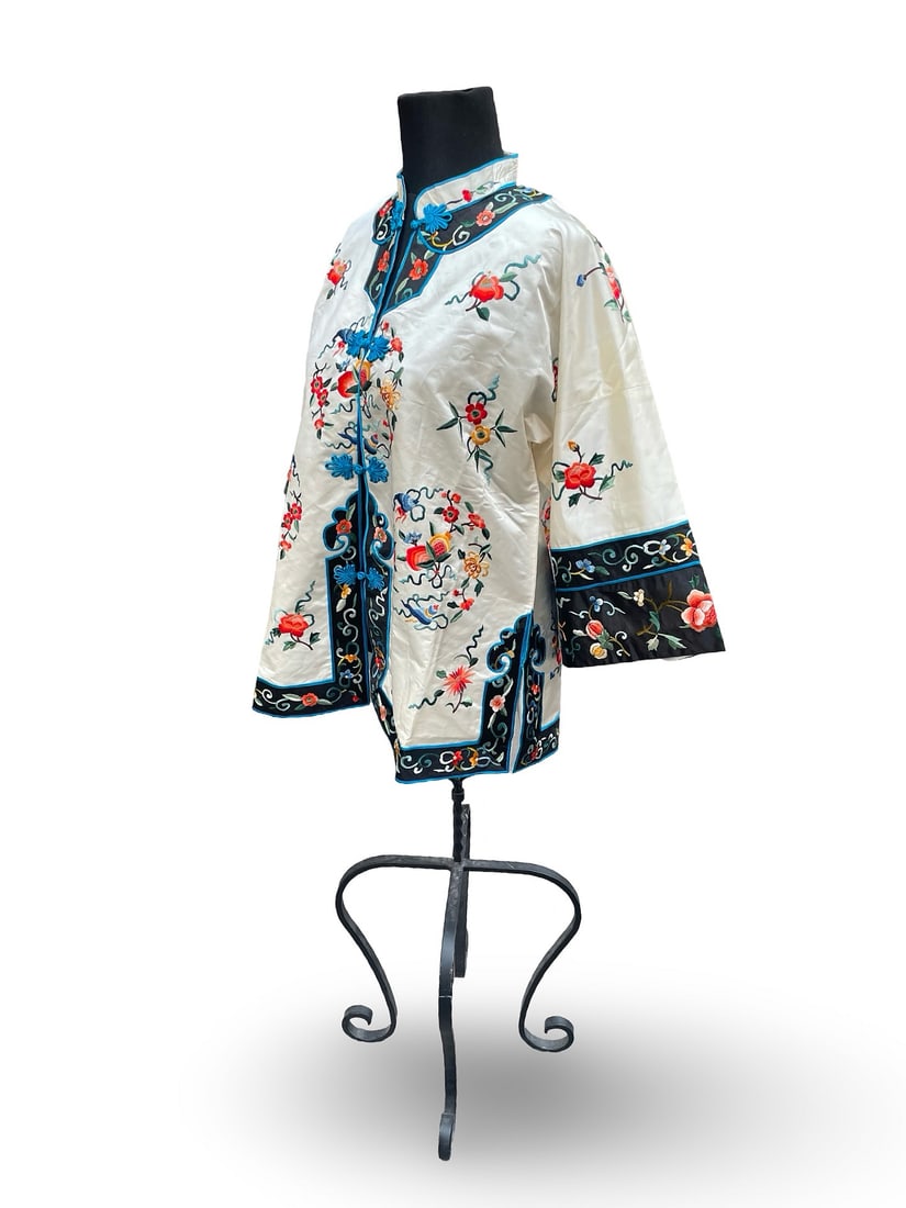 Traditional Chinese Embroidered Robe: Description:20th century Traditional Chinese embroidered robe made of silky fabric. The buttons and button holes are made of silk cord. The embroidery is precise and the colors are vivid. The robe is 