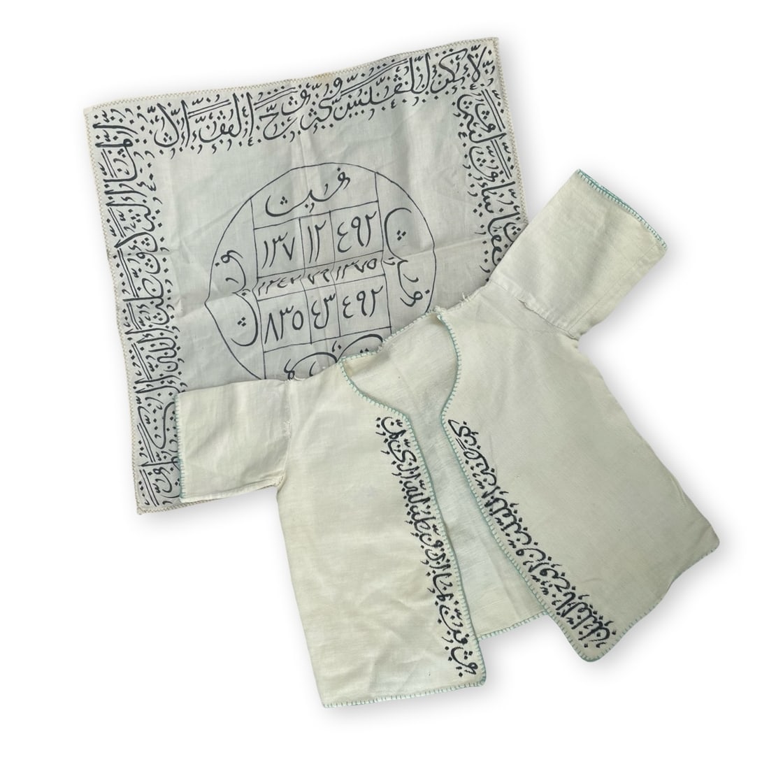 Lot of Talismanic Healing Baby Shirt and Talismanic Healing Cloth: Lot of Islamic Middle Eastern Persian talismanic healing shirt for a newborn baby and talismanic healing cloth. 20th century Islamic Middle Easterntalismanic healing shirt jama for a newborn baby, 27