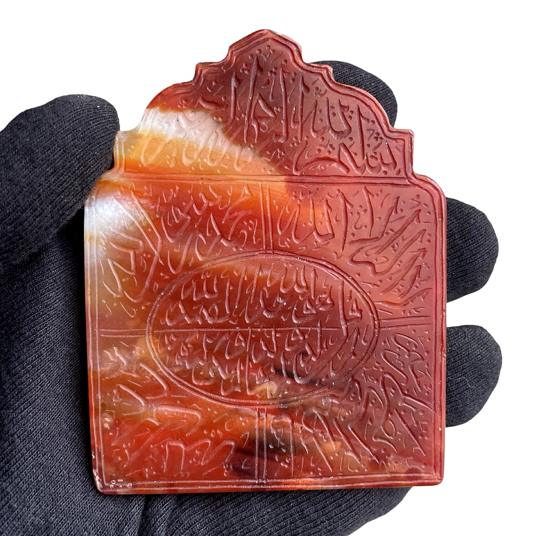 Islamic Middle Eastern Agate Talismanic Plaque / Pendant with Qur’anic Inscriptions: Islamic Middle Eastern Persian agate talismanic plaque / pendant with Qur’anic inscriptions. 9 x 7 cm. This finely carved talismanic plaque is fashioned from banded red and orange agate,