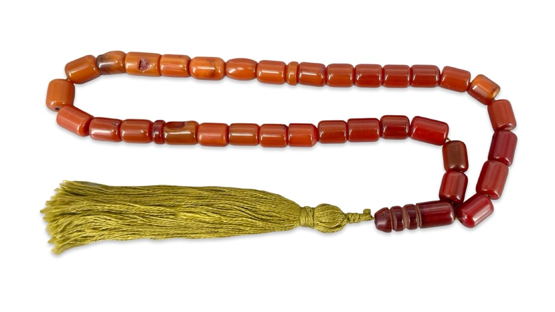 An Islamic Capsule-Cut Catalin 33-Bead Prayer Strand (Tasbih Misbaha) (1 of 3)