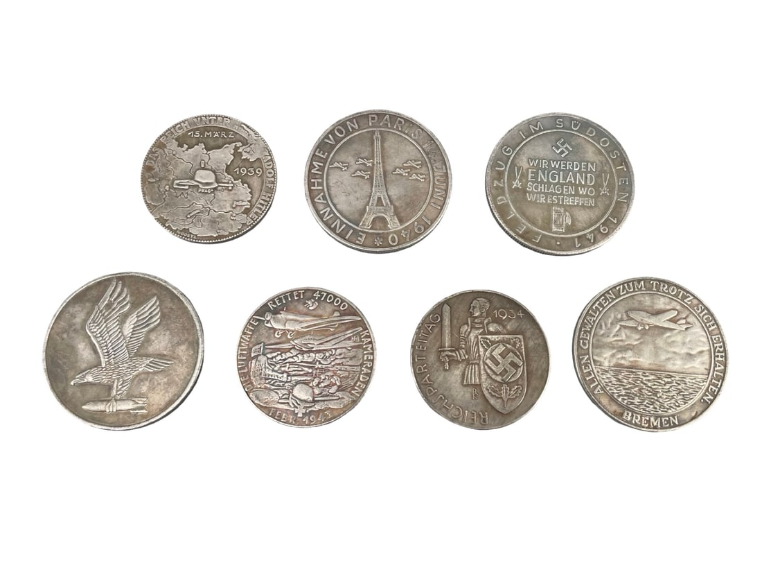 Collection of 7 WWII German Commemorative Medals Campaign Propaganda Coins: Collection of 7 WWII German Commemorative Medals Campaign Propaganda Coins. A historical collection of seven World War II and pre-war era German military commemorative medals and propaganda tokens str