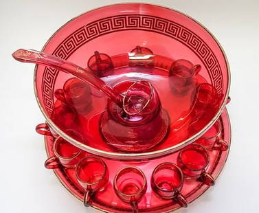 Vintage 18th Century Great Neck, NY Faceted Cranberry Gold Greek Key Punch Bowl (12 Cups): Vintage 18th Century Great Neck, NY Faceted Cranberry Gold Greek Key Punch Bowl (12 Cups). The ladle has been stapled and 3-4 cups appear to have been repaired over time. "Cranberry Glass Punch Bowl