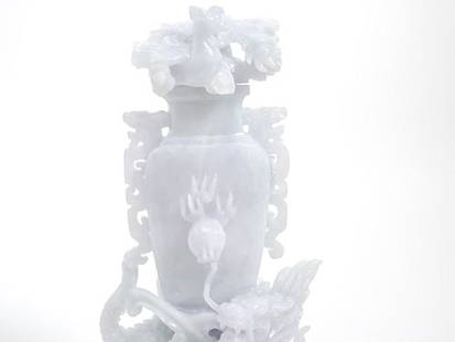 Chinese Jade Lidded Perfume Vase: 7" in tall, the Chinese Jade Lidded Perfume Vase is carved with a dragon wrapped around the base, with archistic handles and no visible marks.