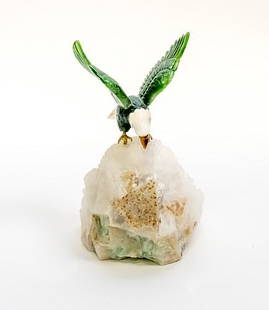 Carved Chinese Green and White Tiger Eye Stone Figure of an Eagle Sculpture: 7 1/2" in High, the Chinese carved green and white tiger eye stone of an eagle landing on a light colored mineral specimen, felt bottom