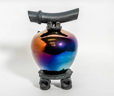 Matthew Lovein, 2006 "Wish Keeper" Raku Ceramic Asian Sculpture: An Asian Raku Ceramic vessel in iridescent tones of blue and pink. Signed and dated on the underside: Lovein 06. The sculpture is 13 1/2 in x 9 in. Matthew Lovein has become an accomplished artist,