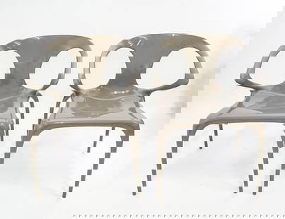 Pair of Roche Bobois Italian AVA Bridge Polycarbonate Chairs: Pair of Roche Bobois Italian AVA Bridge Polycarbonate Chairs with Armrests for Roche Bobois by famous design Song Wen Zhong. The Ava chair combines the ideas of a mythical dragon, reincarnated as a