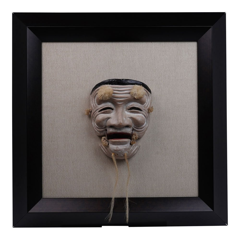 A Noh Mask of Okina, 19th Century Japan, Mounted in a Box Frame on Linen: A One-of-a-Kind Noh Ceremonial Mask of Okina, 19th Century Japan, Framed on Linen. The Ceremonial Mask of Okina, in carved wood and coloured pigments, mica and gesso, yak hair beard, mounted in a box
