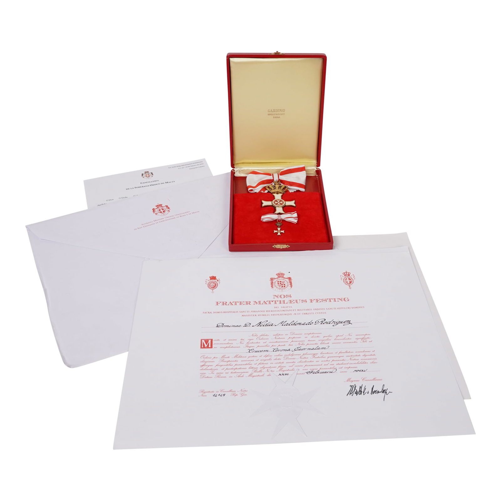 Badge Set for the Sovereign Military Order of Malta (SMOM): This is a badge set for the Sovereign Military Order of Malta (SMOM). The set includes a large cross badge with a crown suspension and a ribbon, along with an additional jacket pin. The badge features