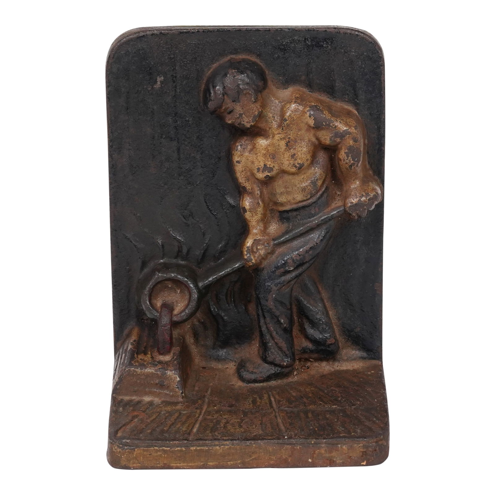 Brutalist Vintage Cast Iron Circa 1920s Cast Iron Bookend Display: Brutalist Vintage Cast Iron Circa 1920s Cast Iron Bookend Display. This is a vintage cast iron bookend featuring a design of a foundry worker pouring molten metal. It is a heavy, large piece made of s