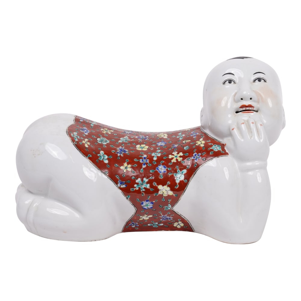 Chinese Vintage Porcelain Ceramic Figural Boy Pillow: Chinese Vintage Porcelain Ceramic Figural Boy Pillow. This 20th Century Chinese Famille Rose Headrest is Approximately 11 1/2 in x 8 in. x 8 in. Provenance: Naples, FL Estate. House of Craven Auction