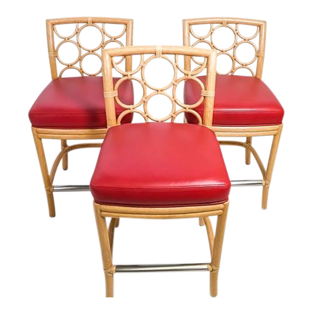 RARE Three (3) Laura Kirar for McGuire O Ring or Target Bar Stools With Red Leather: Set of 3 Laura Kirar for McGuire "O-Ring or Target Rattan Bar Stools Each Labeled McGuire San Francisco in Brass Plates. Dimensions: 18 in. x 17 in. D x 41 in. (H). The Laura Kirar Ring Barstool empha
