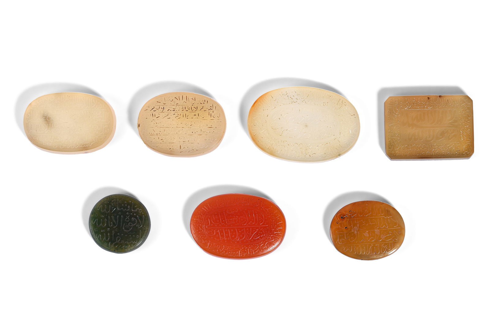 SEVEN ENGRAVED HARDSTONE AMULETS WITH QURANIC SURAS AND PRAYERS Iran and India, second half 19th and (1 of 14)