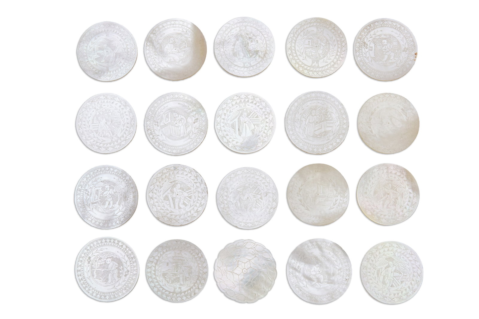A GROUP OF TWENTY CIRCULAR MOTHER-OF-PEARL COUNTERS China, Qing dynasty, 19th century: A GROUP OF TWENTY CIRCULAR MOTHER-OF-PEARL COUNTERS China, Qing dynasty, 19th century Containing a set of twelve counters, and a set of seven counters, each with incised with a figure in a garden with
