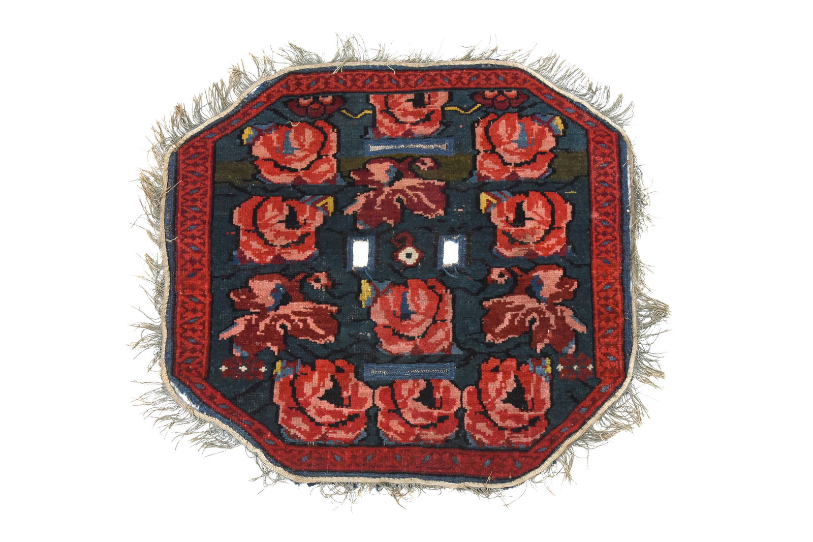 A RARE OCTAGONAL SADDLE POMMEL CARPET COVER Possibly Kirman, Central Iran, late 19th century (1 of 3)