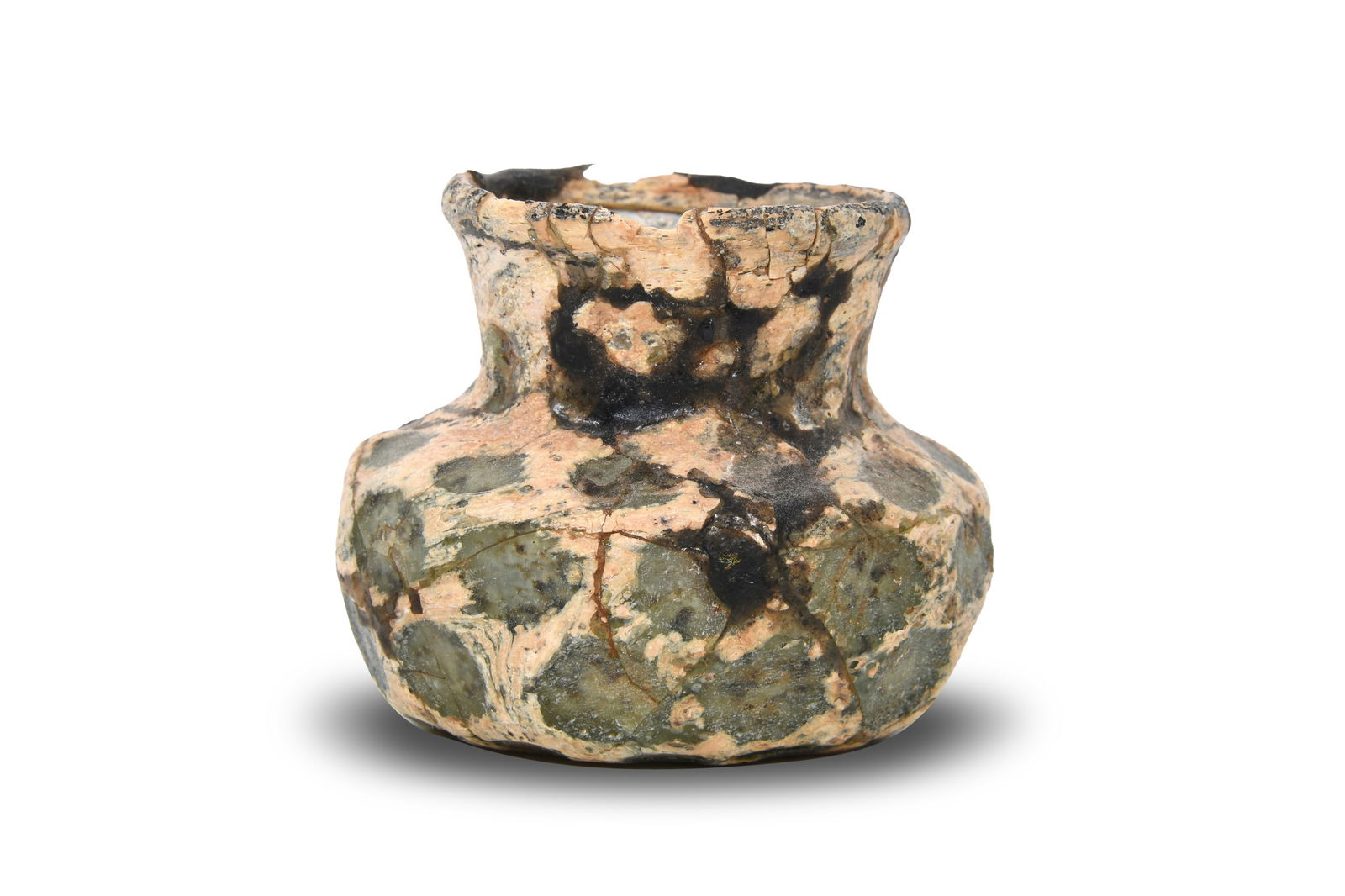 A SMALL HONEYCOMB-FACETED CLEAR LIGHT GREEN GLASS VASE Possibly Nishapur, Iran, 10th - 12th century: A SMALL HONEYCOMB-FACETED CLEAR LIGHT GREEN GLASS VASEPossibly Nishapur, Iran, 10th - 12th century Of compressed globular shape, with a concave base, rising to an everted cylindrical neck, faceted in