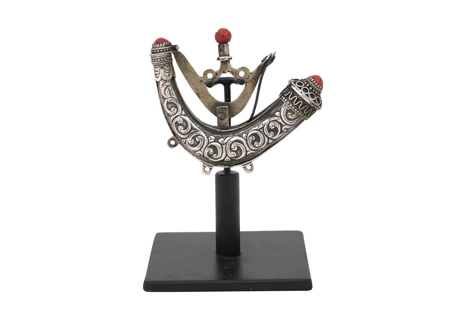 AN ALGERIAN CORAL-SET SILVER AND WHITE METAL MINIATURE GUNPOWDER FLASK Algeria, North Africa, second: AN ALGERIAN CORAL-SET SILVER AND WHITE METAL MINIATURE GUNPOWDER FLASKAlgeria, North Africa, second half 19th century Of exaggerated curved, C-like shape, the