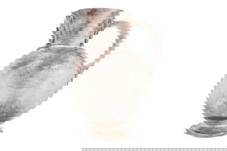 A SILVER-PLATED JUG WITH A MONOGRAM Circa 1900: A SILVER-PLATED JUG WITH A MONOGRAM Circa 1900 With a plain bulbous body resting on a flared foot, engraved with the initials IB to the front, set with a C-shaped handle and a flared neck and a