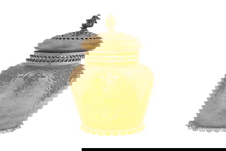 A YELLOW METAL MARTIN HALL & CO LIDDED JAR Sheffield, England, possibly late 19th century: A YELLOW METAL MARTIN HALL & CO LIDDED JAR Sheffield, England, possibly late 19th century Of baluster form, upon a narrow petalled foot and widening to shoulders decorated with foliate curls in