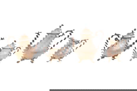 A SILVER PLATED TEA AND COFFEE SERVICE BY WEBSTER WILCOX Circa 1961 - 1981: A SILVER PLATED TEA AND COFFEE SERVICE BY WEBSTER WILCOX Circa 1961 - 1981 Including a coffee pot, a teapot, a milk jug and a lidded sugar bowl, each piece with a pear-shaped body set with scrolling