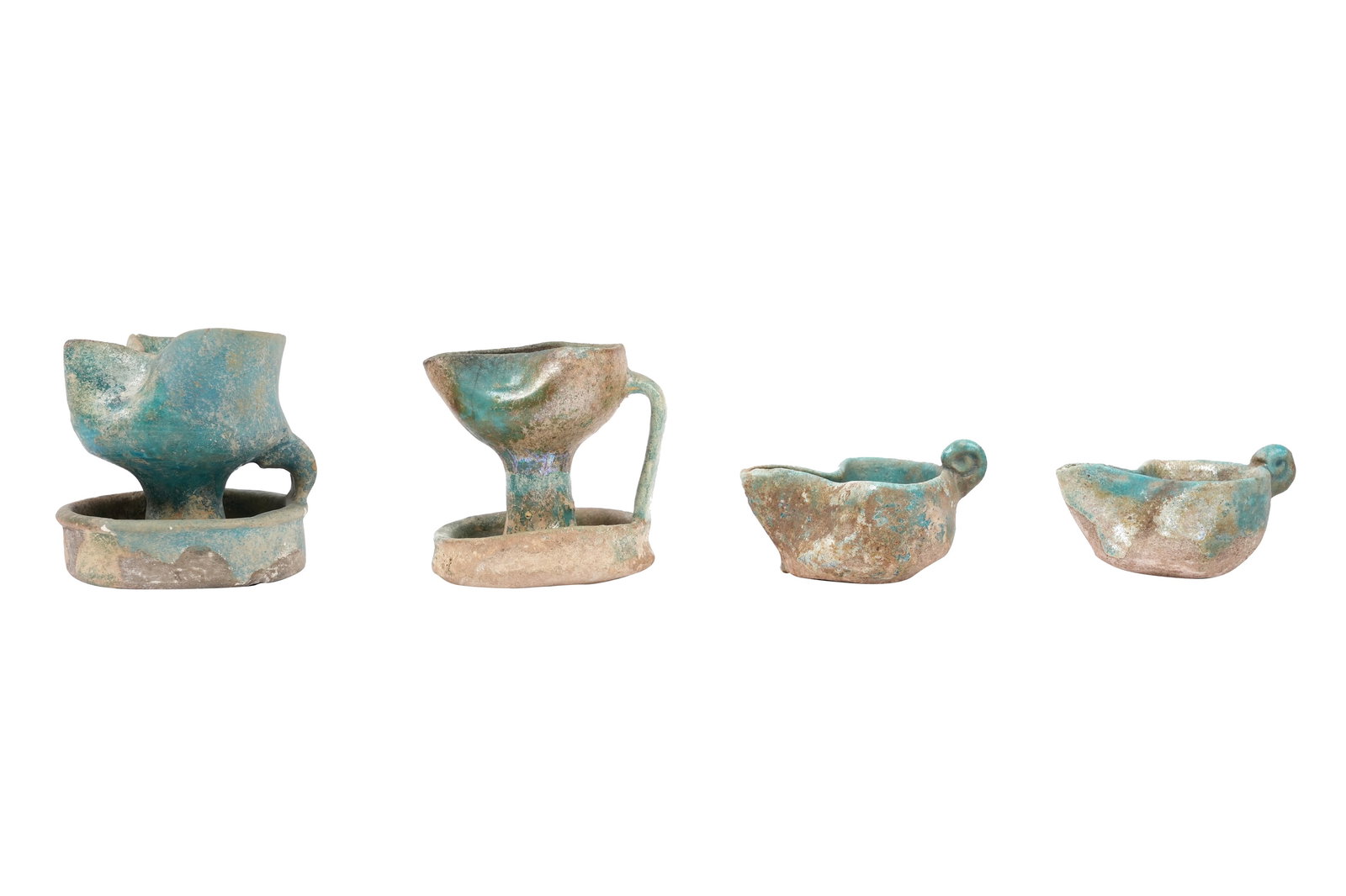 A COLLECTION OF FOUR PERSIAN SELJUK GLAZED POTTERY OIL LAMPS Seljuk Iran, 12th century (1 of 6)