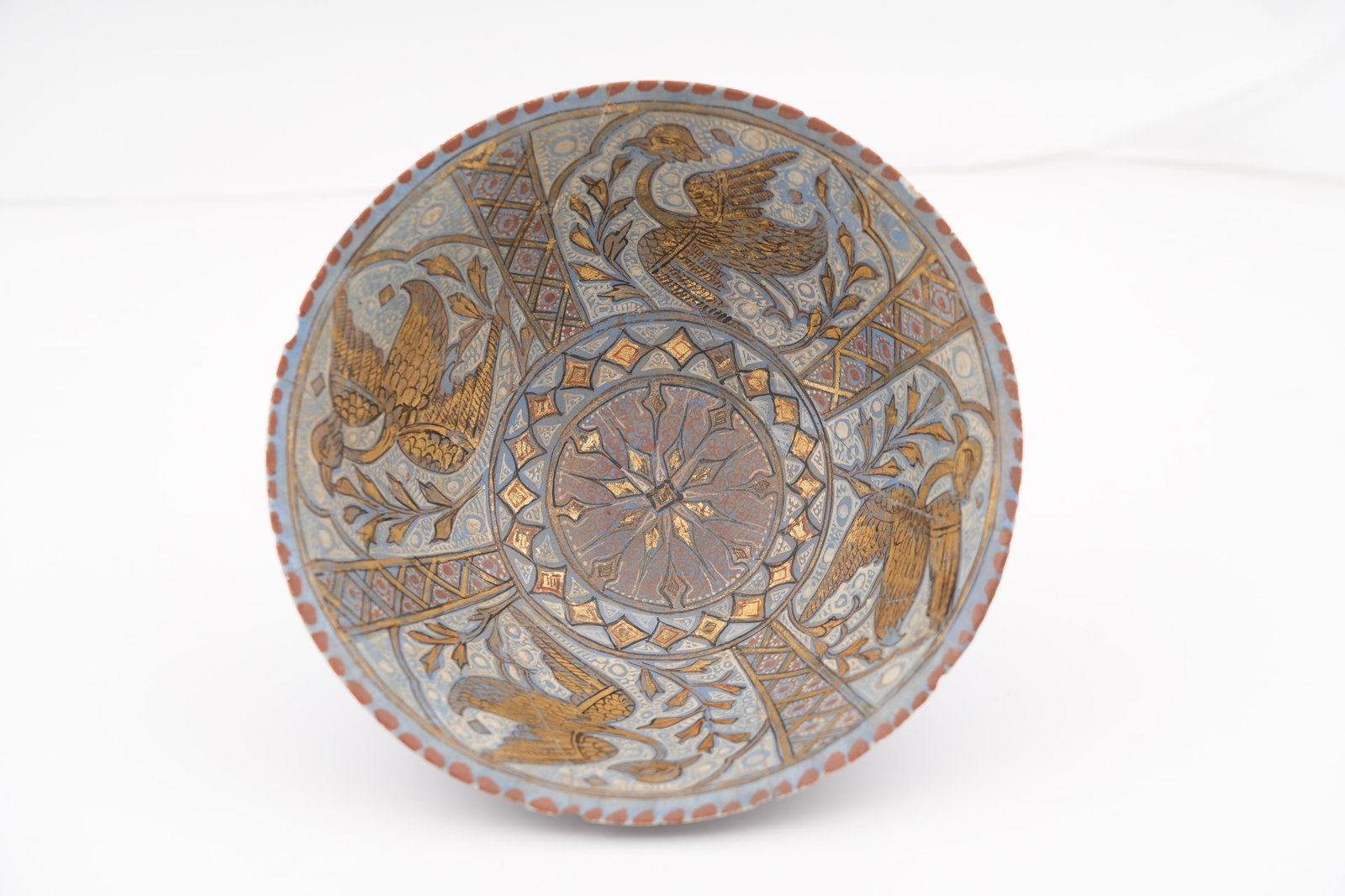 A LAJVARDINA GILDED POTTERY BOWL Ilkhanid Iran, late 13th - early 14th century (1 of 8)