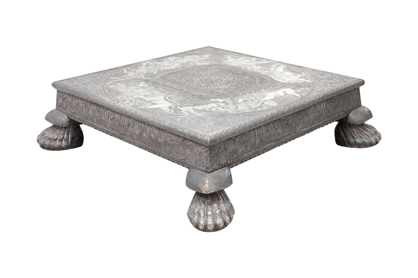 A MONUMENTAL WOODEN FOOTSTOOL OVERLAID WITH CHASED SILVER Probably Baroda region, Gujarat, India, 19 (1 of 9)