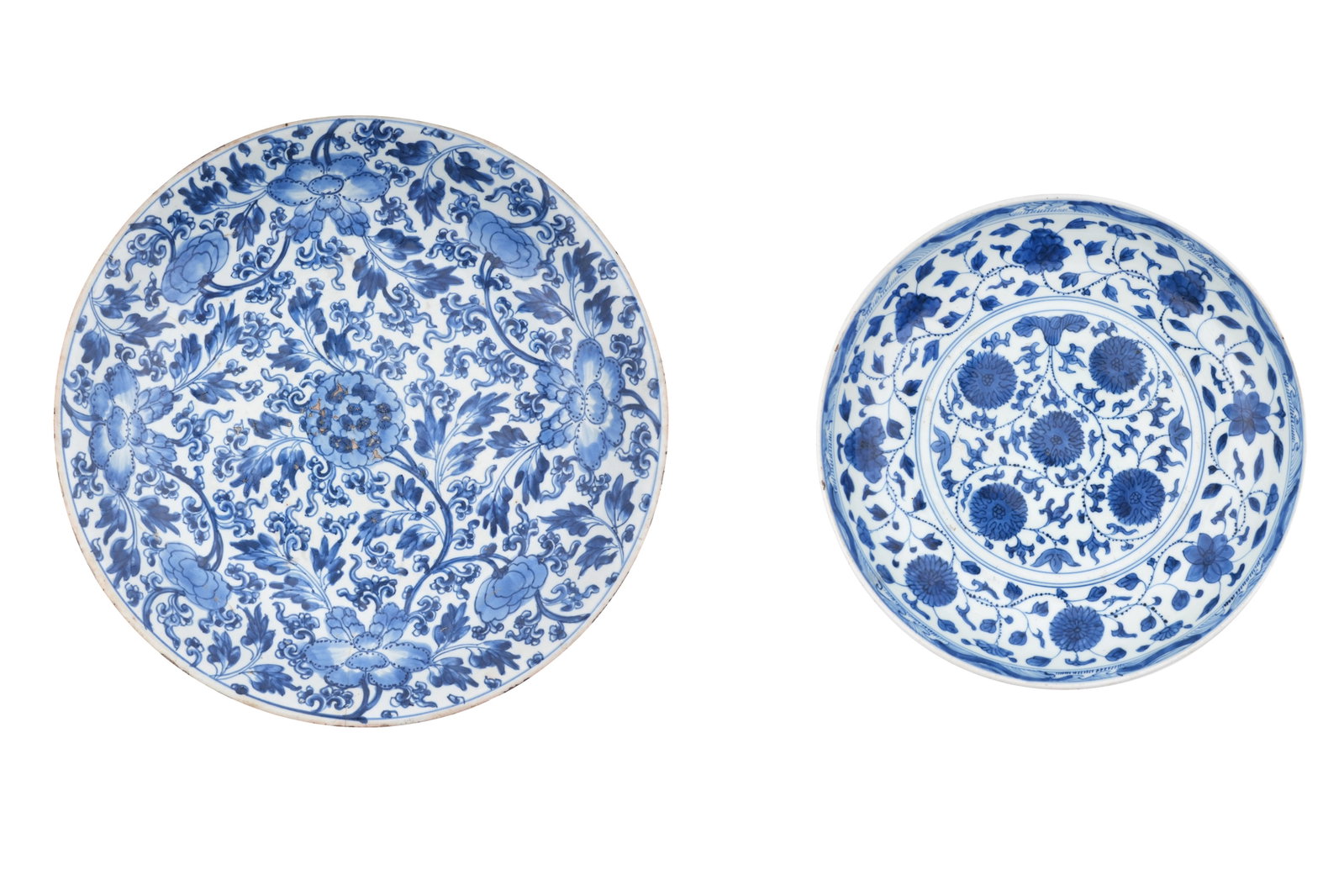 TWO CHINESE BLUE AND WHITE DISHES Qing dynasty, 18th / 19th century: TWO CHINESE BLUE AND WHITE DISHES Qing dynasty, 18th / 19th century The first a large, thickly potted charger decorated with a tapestry of peony flowerheads and foliage to the well and freely painted 