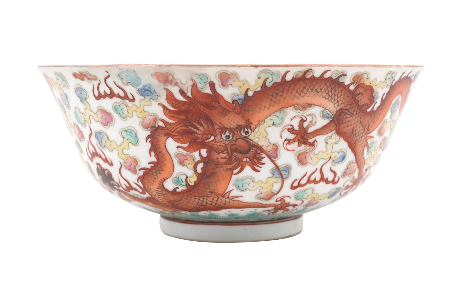 A CHINESE FAMILLE ROSE 'DRAGON' BOWL Qing dynasty, 19th century: A CHINESE FAMILLE ROSE 'DRAGON' BOWL Qing dynasty, 19th century With a flared body rising from a short foot painted with two ferocious scaly beasts chasing flaming pearls among colourful ruyi clouds a