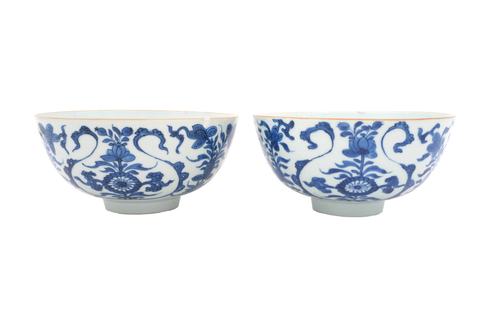 A PAIR OF CHINESE BLUE AND WHITE 'BLOSSOMS' BOWLS Circa 1900: A PAIR OF CHINESE BLUE AND WHITE 'BLOSSOMS' BOWLS Circa 1900 Each with a rounded body raised on a short foot, painted to the exterior with sprays of blossoms and foliage, the interiors with a single o
