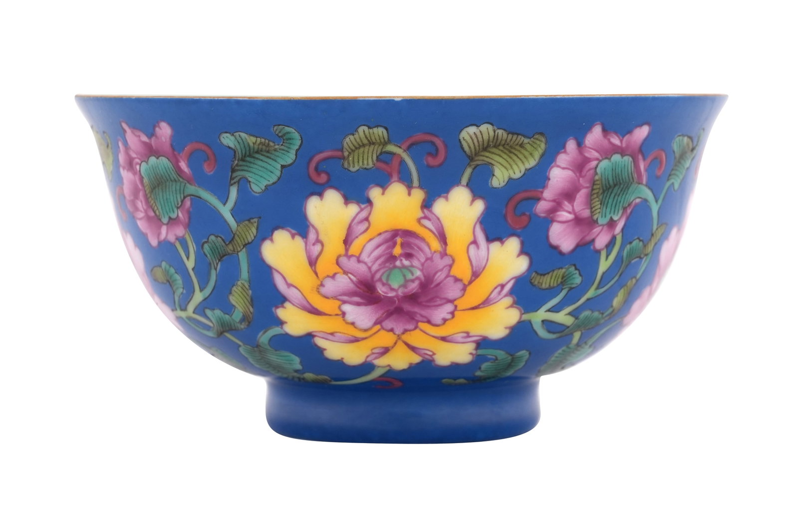 A CHINESE ENAMELLED FAMILLE ROSE 'BLOSSOMS' BOWL 20th century: A CHINESE ENAMELLED FAMILLE ROSE 'BLOSSOMS' BOWL 20th century The flared body painted to the exterior with large pink and yellow flowerheads and scrolling foliage against a blue ground, the interior a
