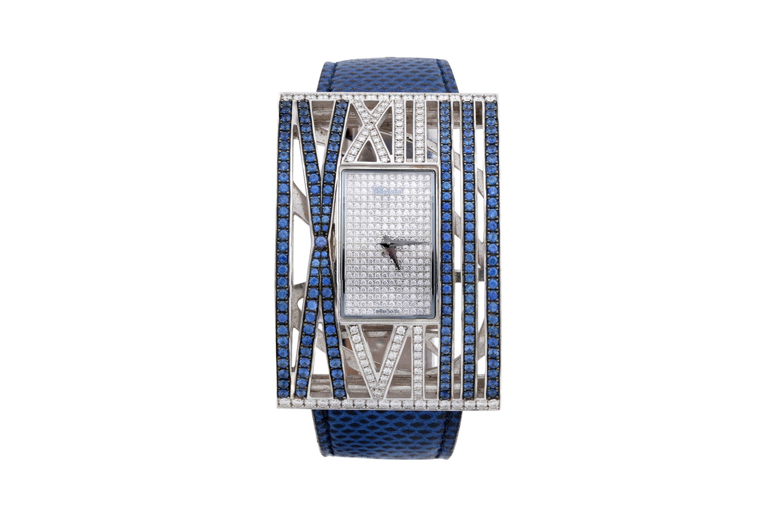 A CHOPARD 'MONTRE DAME XL' 18CT WHITE GOLD, SAPPHIRE AND DIAMOND LADIES WRISTWATCH 13/7130-38: A CHOPARD 'MONTRE DAME XL' 18CT WHITE GOLD, SAPPHIRE AND DIAMOND LADIES WRISTWATCH The rectangular dial studded with round cut diamonds and with dauphine hands, within a large rectangular border of ro