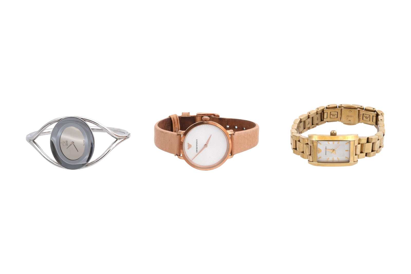 THREE LADIES DESIGNER WATCHES Boxed: THREE LADIES DESIGNER WATCHES Comprising a gold plated Emporio Armani example with an engine turned dial on a pale leather strap, a gold plated bracelet watch by the same maker, with a rectangular hob