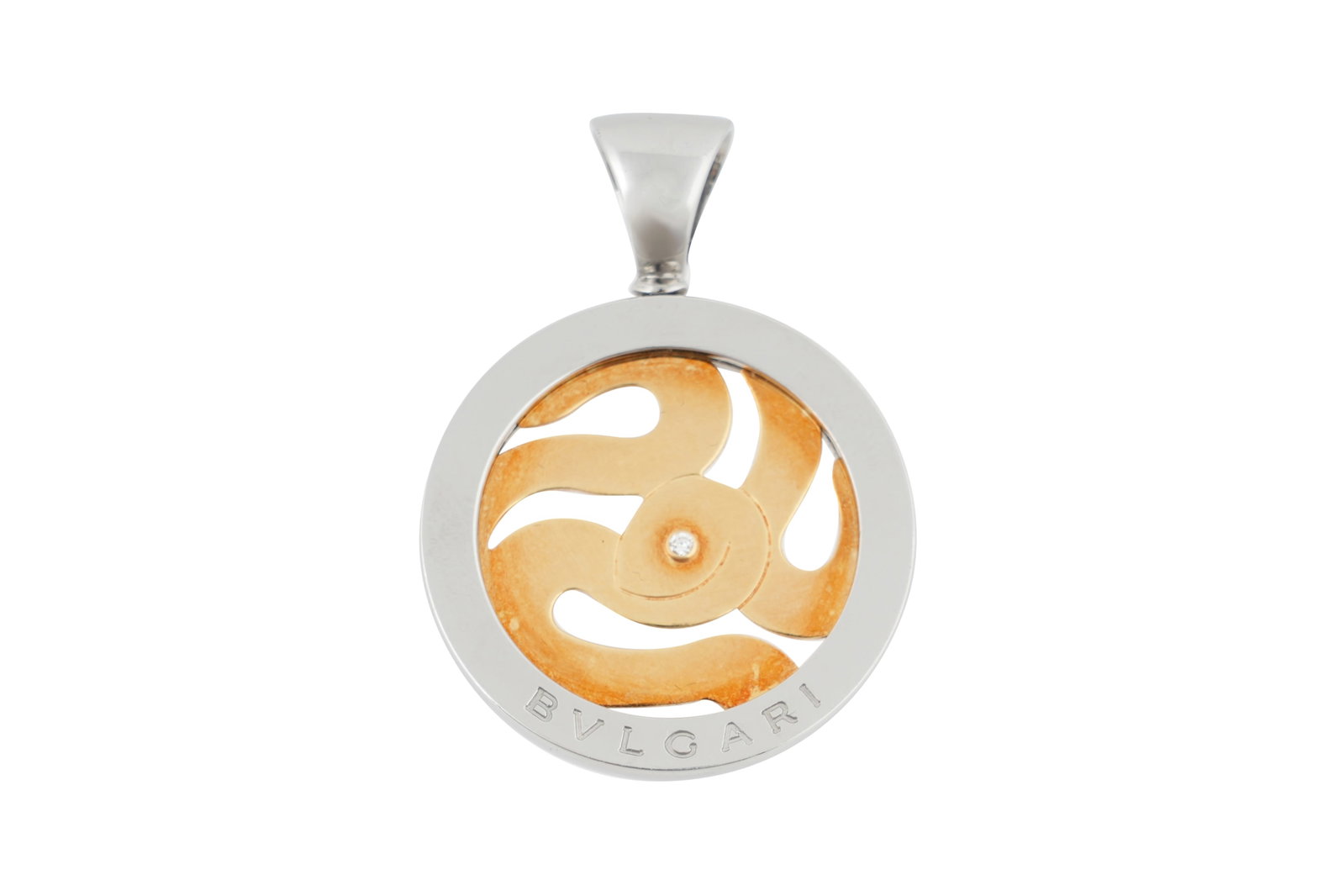 AN 18CT YELLOW GOLD AND DIAMOND BULGARI TONDO SNAKE PENDANT: AN 18CT YELLOW GOLD AND DIAMOND BULGARI TONDO SNAKE PENDANT With a central round cut diamond of approximately 0.02 carats, set in a 18ct yellow gold snake design modernist pendant, enclosed in a steel