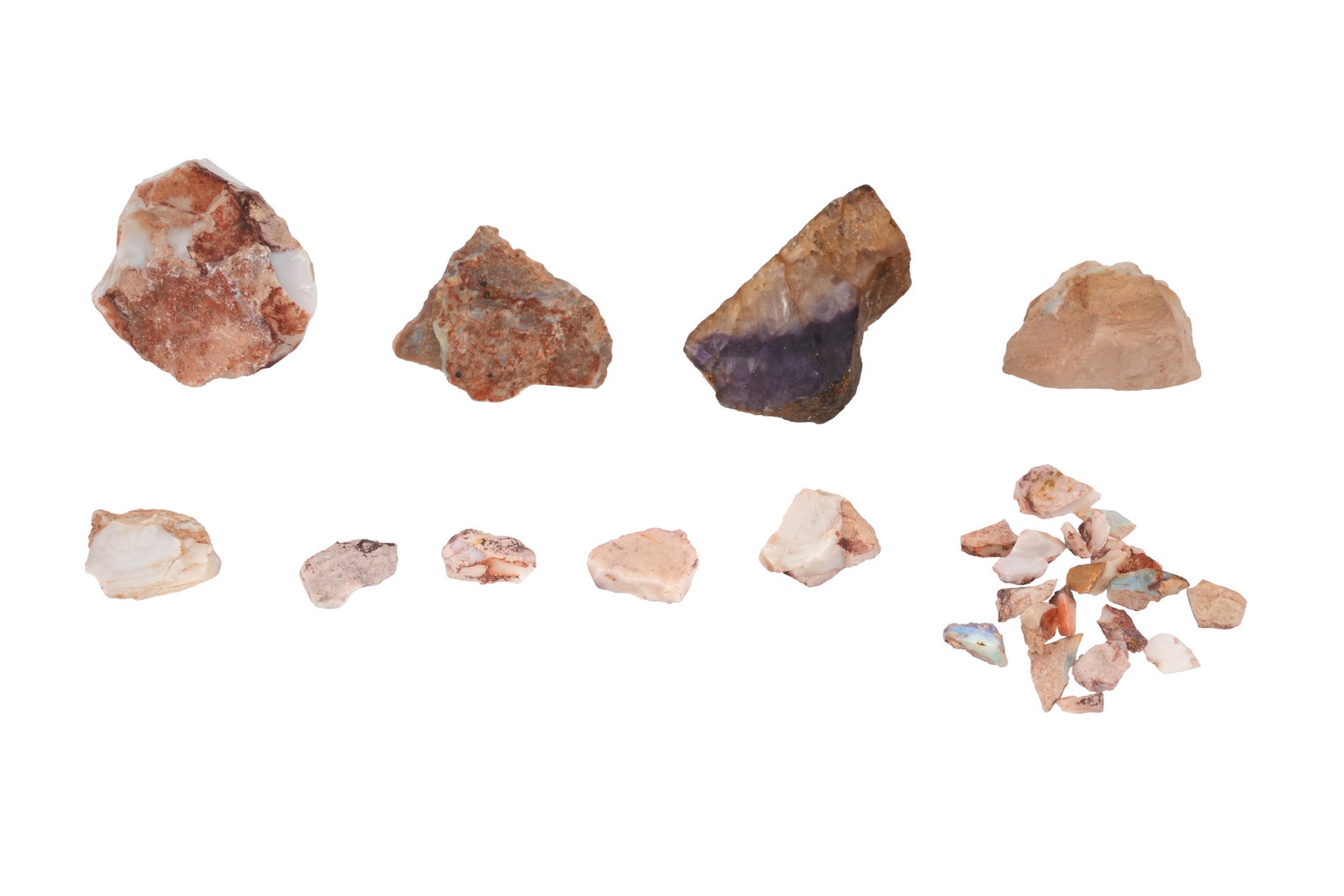 A COLLECTION OF OPAL AND BLUEJOHN FRAGMENTS Coober Pedy, Australia: A COLLECTION OF OPAL AND BLUEJOHN FRAGMENTS Comprising a single piece of Bluejohn and a quantity of opals of varying sizes, the opal fragments found in Coober Pedy, Australia Largest approximately 6cm