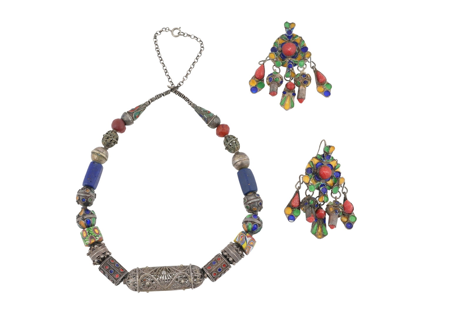 A BERBER KABYLE TRIBE SILVER AND BEADWORK NECKLACE AND EARRINGS SUITE: A BERBER KABYLE TRIBE SILVER AND CORAL NECKLACE AND EARRINGS SUITE With elaborate filigree work and enamel decoration in blues, yellows and greens (3) Gross weight 97.6grs; necklace length 50cm; earri