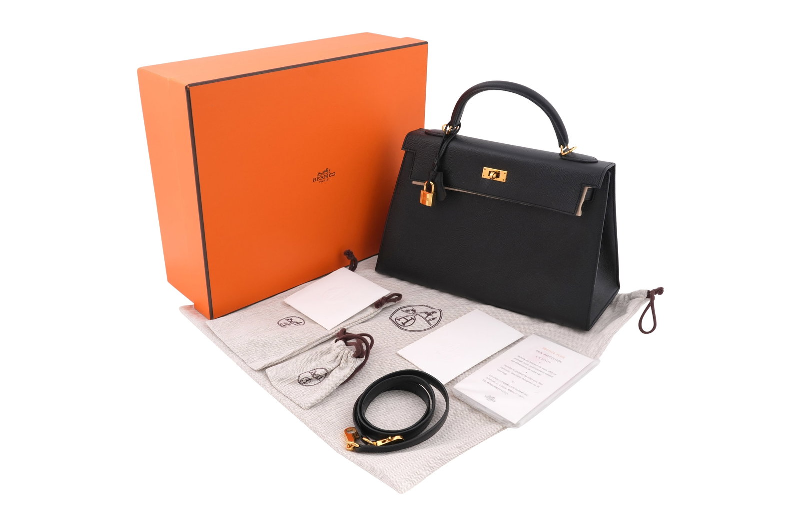 AN HERMÈS KELLY II SELLIER 32 HANDBAG IN BLACK WITH GOLD HARDWARE Made in France, purchased in 2016: AN HERMÈS KELLY II SELLIER 32 HANDBAG IN BLACK WITH GOLD HARDWARE Made in France, purchased in 2016 An exceptionally desirable and highly collectible Hermès Kelly II Selli