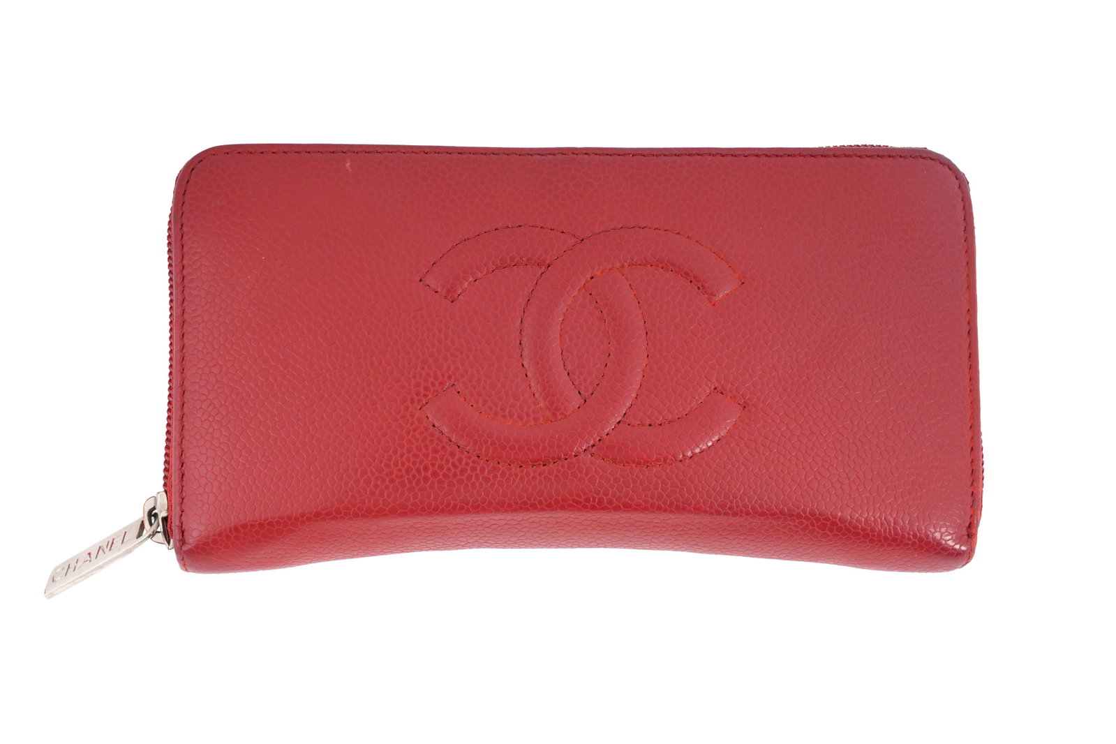 A CHANEL LIPSTICK RED CAVIAR LEATHER ZIP-AROUND WALLET Made in Italy, c.2012–2013: A CHANEL LIPSTICK RED CAVIAR LEATHER ZIP-AROUND WALLET Made in Italy, c.2012–2013 A classic Chanel zip-around wallet crafted in vibrant red caviar-grain leather, the exterior featuring the i