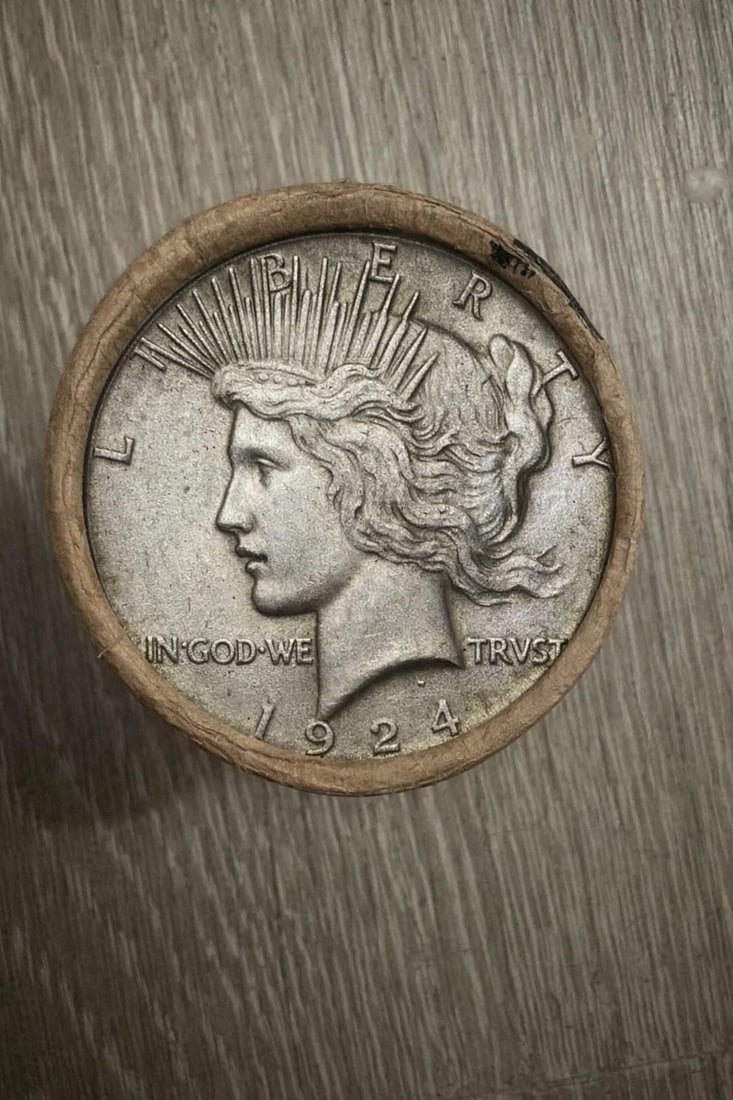 $20 AU Peace Silver Dollar Roll 1924 & 1922 Ends: Original $20 face value roll of About Uncirculated Peace Silver Dollars featuring 1924 and 1922 dated coins on the visible ends. Coins display light circulation wear with strong remaining detail. The